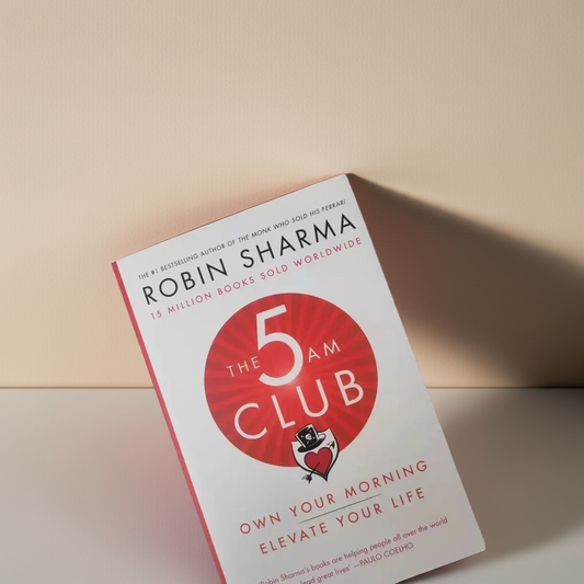 The 5AM Club book cover by Robin Sharma, featuring the title and author's name with a graphic of a clock showing 5am.