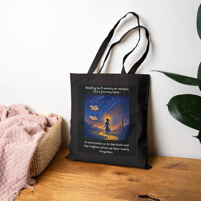 Black tote bag with a colorful design and text on a wooden surface. Booklover Grocery Tote Bag