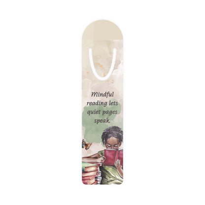 Bookmark with a child reading a book and the quote 'Mindful reading lets quiet pages speak' on a white background.