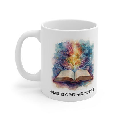 White mug with a colorful design of an open book and 'One More Chapter' text on a white background