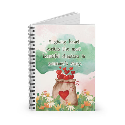 Notebook with a heart-themed cover and inspirational quote on a white background