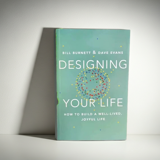 Book titled 'Designing Your Life' by Bill Burnett and Dave Evans on a light gray background